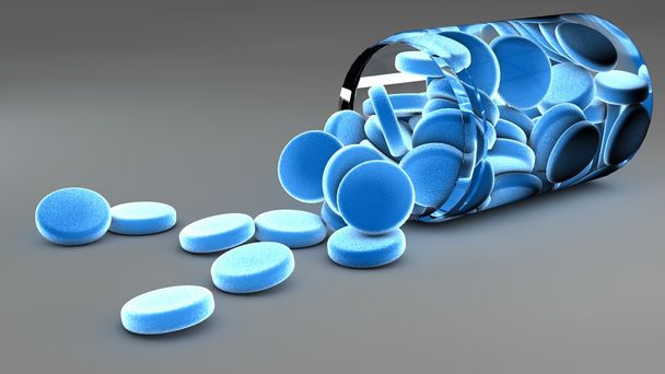 Píldoras azules derramadas y frasco
 - Foto, imagen