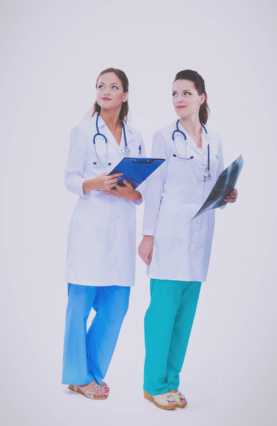 Two young woman doctor , standing in hospital . - Foto, imagen
