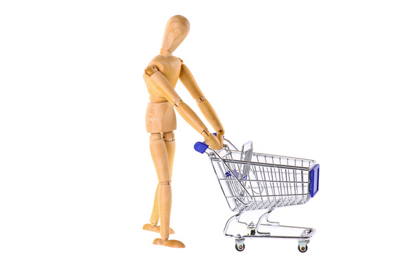 Wooden doll with shopping cart - Photo, Image
