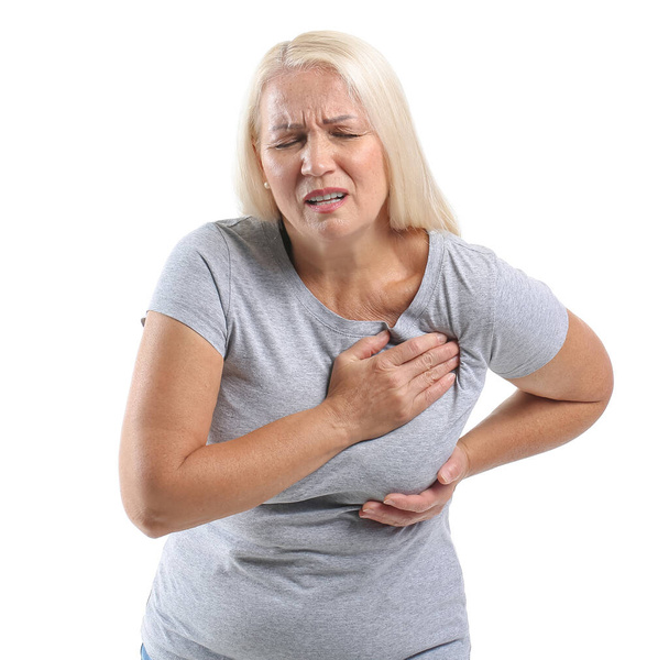 Mature woman suffering from breast pain on white background - Fotó, kép