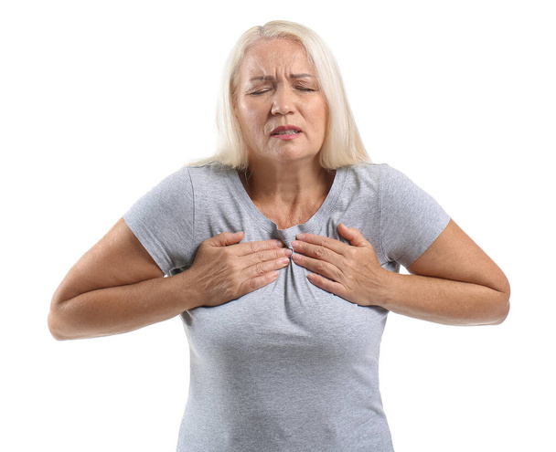 Mature woman suffering from breast pain on white background - Foto, Imagem