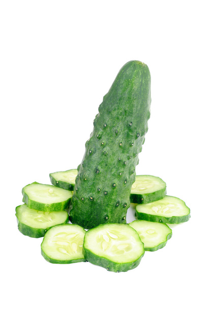 Cucumber solar clock. Cucumber and slices isolated over white background. - Photo, Image