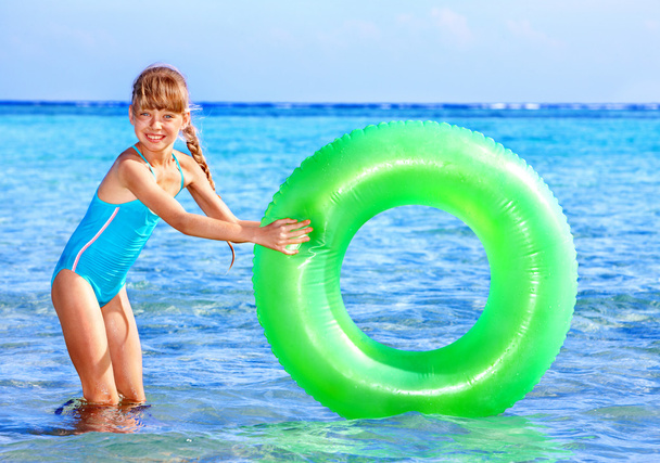 Child holding inflatable ring.. - Photo, Image