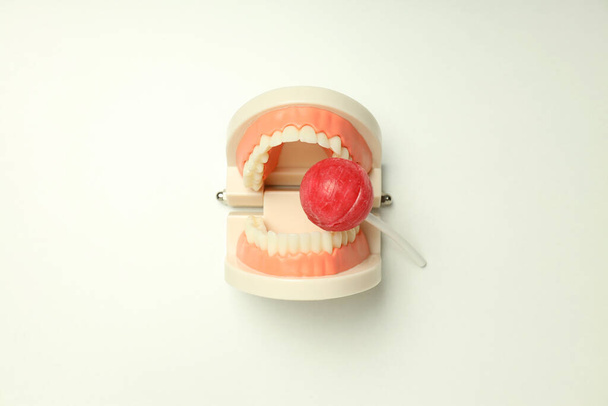 Concept of food bad for teeth on light background - Fotó, kép