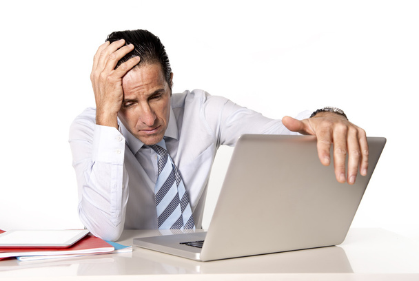 Desperate senior businessman in crisis working on computer at office in stress - Foto, Imagen