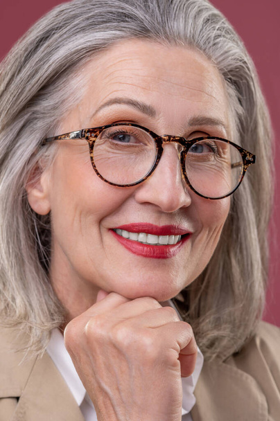Woman in eyeglasses. Close up of a pampered mature woman in eyeglasses - Φωτογραφία, εικόνα