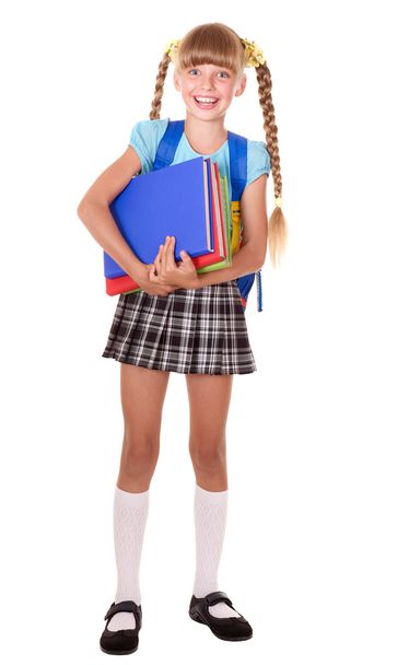 Schoolgirl with backpack holding books. - Fotó, kép