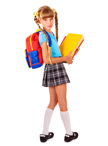 Schoolgirl with backpack holding books. - 写真・画像