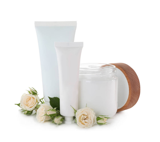 Different hand care cosmetic products and roses on white background - Valokuva, kuva