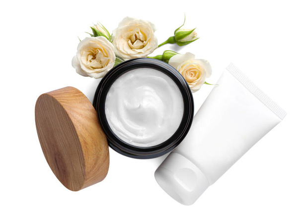 Different hand care cosmetic products and roses on white background, top view - Photo, image