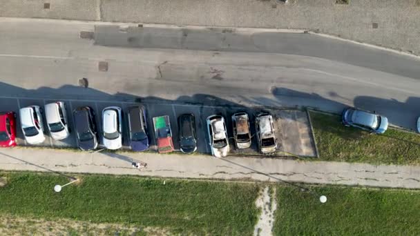 Burned cars in a city parking. Vandalism concept, aerial view drom drone - Metraje, vídeo