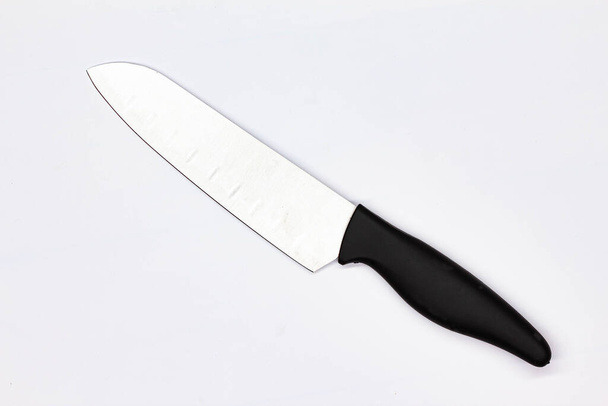 Kitchen knife for meat on white background. Chef Butchers knife for Cutting Meat. Boning knife for cutting raw meat. Kitchenware. Professional food preparation. Close-up. Top view. Isolated - Zdjęcie, obraz