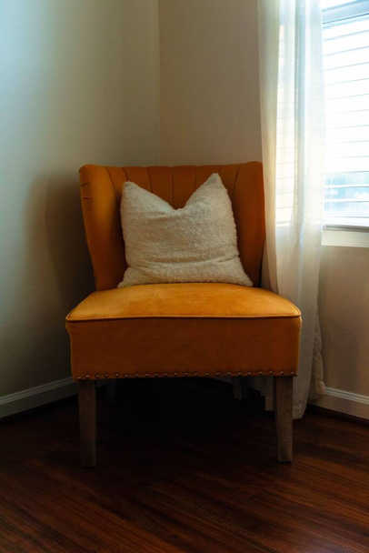 A closeup shot of an orange armchair - Foto, imagen