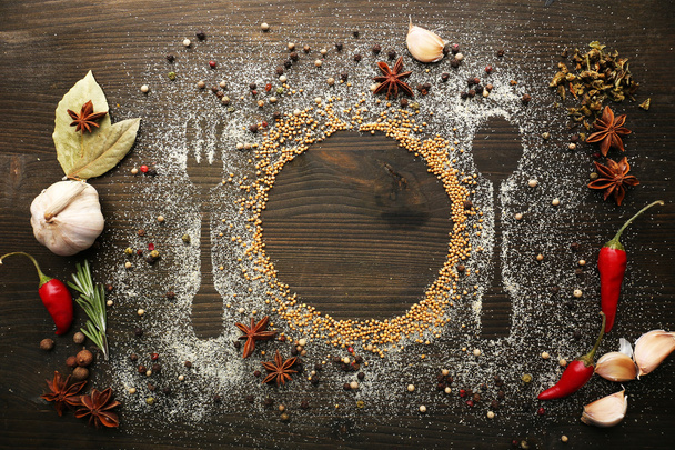 Spices on table with cutlery silhouette - Foto, Imagem