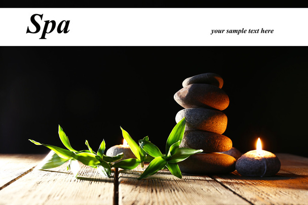 Spa stones, candles on wooden table - Foto, Imagem