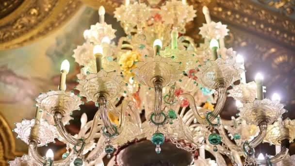 Peles Castle interior in Romania. Close view of a chandelier made in classic style - Materiał filmowy, wideo