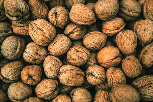 dry fresh nutritious healthy walnuts, natural background - Foto, Imagen