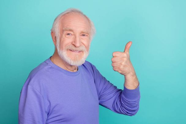 Portrait of cheerful nice person arm finger demonstrate thum up fine awesome isolated on emerald color background. - Foto, Bild