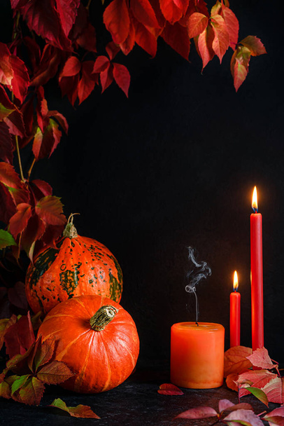 Halloween frame with pumpkins and burning candles on dark background. Mockup - Photo, Image