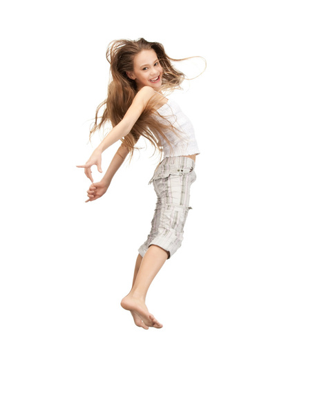 Jumping teenage girl - Фото, изображение