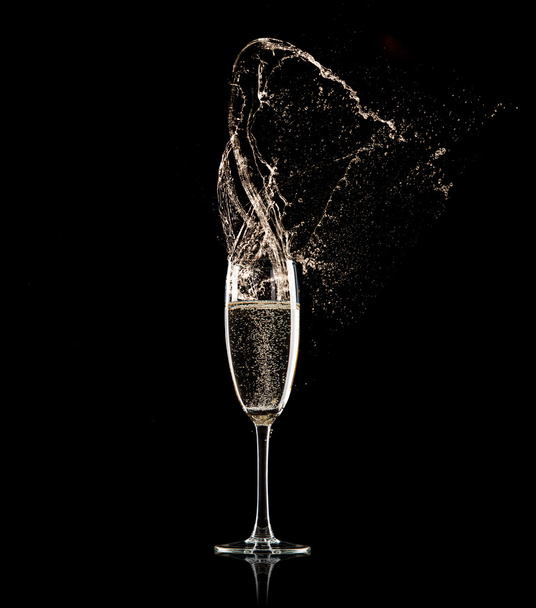 Champagne glass on black background - Photo, Image