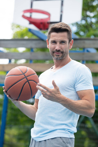handsome male playing basketball outdoor - Fotoğraf, Görsel