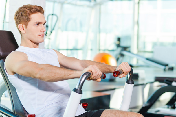 Man working out in gym - Photo, Image