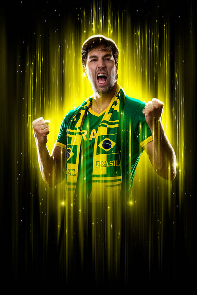 Brazilian fan, celebrating on a yellow and black backgroun, cheering for Brazil to be the champion. - Foto, imagen