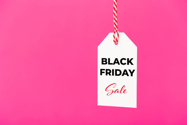 Black Friday Sale white price tag isolated on pink background. Shopping, sale, discount concept - Photo, image