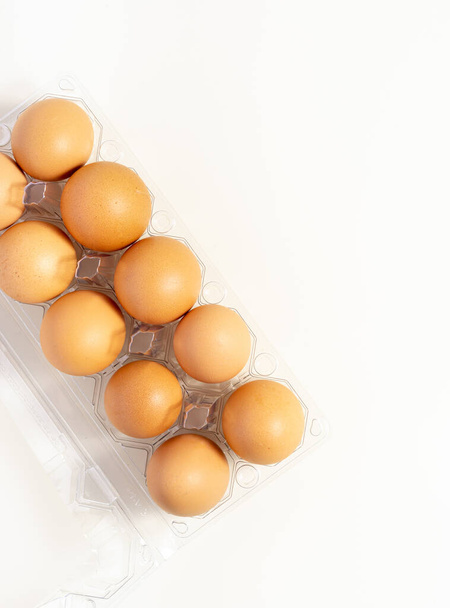 Organic Egg in Clear Pack Isolated on White. Top view. Place For Text. - Fotografie, Obrázek