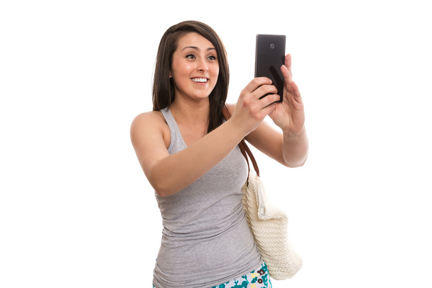 Attractive female tourist taking selfie - 写真・画像