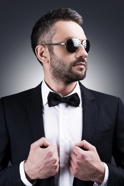 Mature man in formalwear and sunglasses - 写真・画像