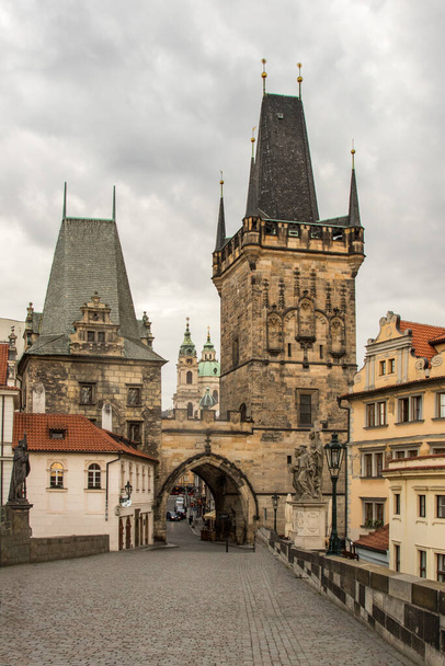 Low angle view from the Saint Charles Bridge of cityscape in Prague, Czech Republic  - Foto, afbeelding