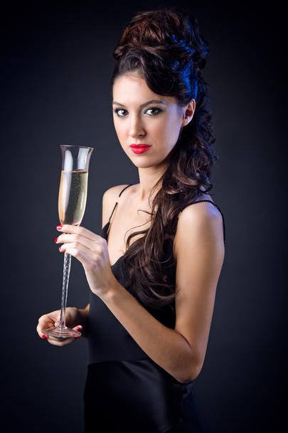 Beautiful girl in evening dress with wine glass. New Year's Eve. - Zdjęcie, obraz