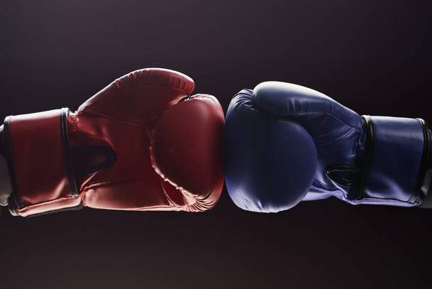 Two mens hands in boxing gloves. Confrontation concept - Foto, Bild