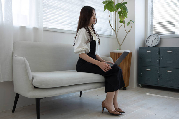 Tokyo Japan 06.19.2022. This working scene is acted by Japanese model in the office. High quality photography - 写真・画像