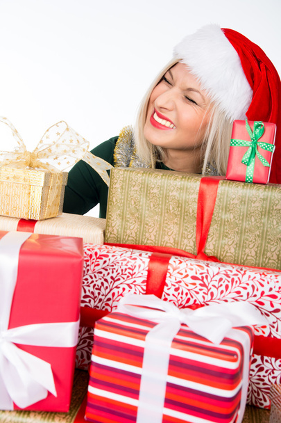 Portrait of casual happy woman holding a lot of gifts - Photo, image