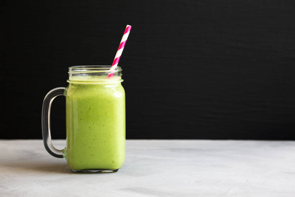Homemade Greek Yogurt Green Smoothie with Spinach and Banana in a Jar, side view. Copy space. - Zdjęcie, obraz