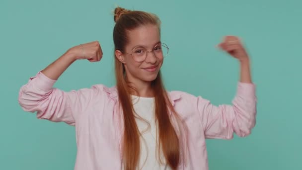 I am strong and independent. Pretty teenager young girl showing biceps and looking confident, feeling power strength to fight for rights, energy to gain success win. Fit sporty student child kid - Filmmaterial, Video