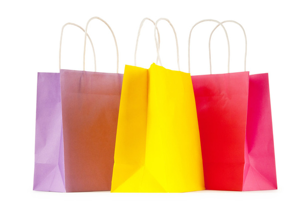 Colourful paper shopping bags isolated on white - 写真・画像