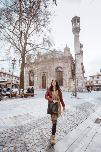 asian woman walking in the square with aziziye mosque at the background - Fotografie, Obrázek