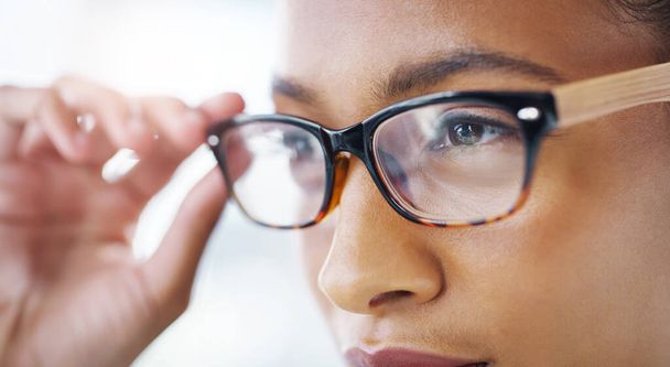 She sees success is on the way. Closeup shot of an attractive young businesswoman wearing spectacles in a modern office - Foto, imagen