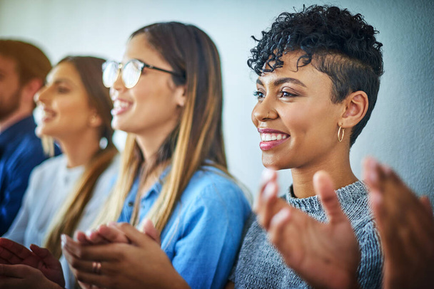 Happiness shared is double happiness. a group of attractive young businesswomen applauding during a conference in a modern office - Foto, immagini