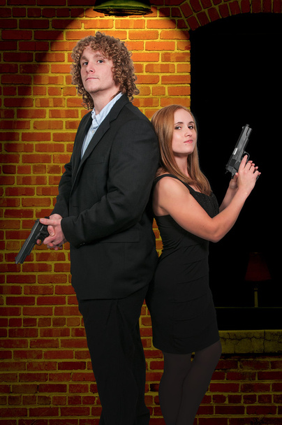 Couple with Guns - Photo, Image