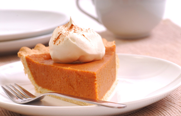 Slice of pumpkin pie with whipped cream - Fotó, kép