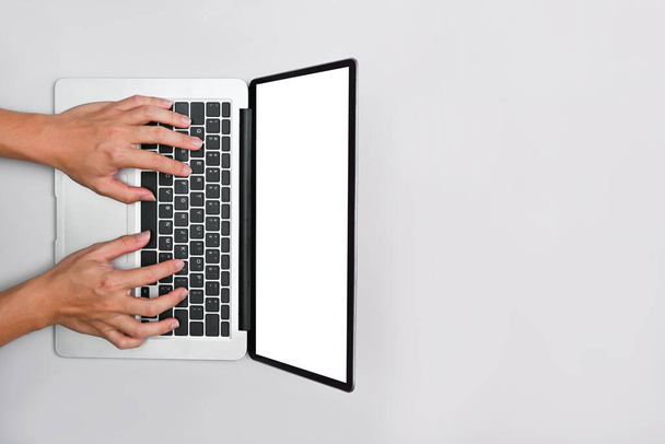 Overhead view man hands typing on laptop. Top view with copy space for your advertise text. - Zdjęcie, obraz