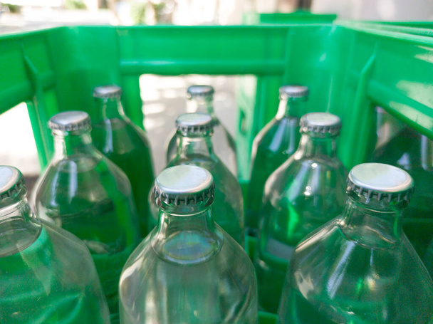 Glass bottled water on his box. Selective focus - Foto, immagini
