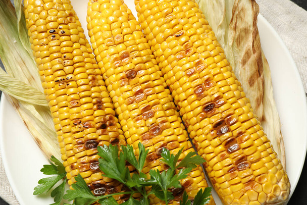 Top view of tasty grilled corn, closeup - Fotó, kép