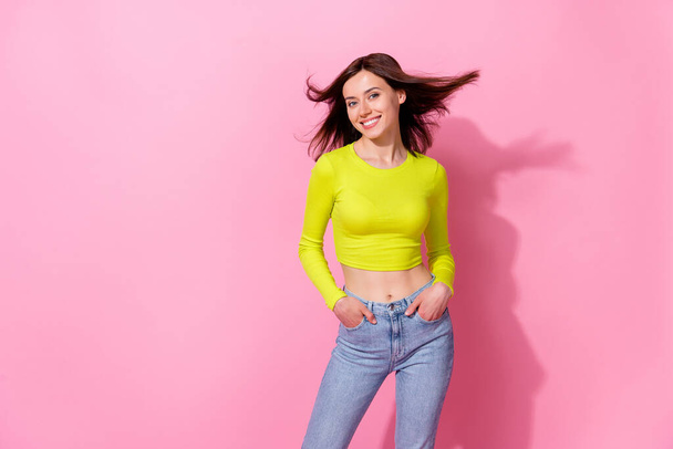 Photo of funny charming lady wear yellow top air blowing empty space isolated pink color background. - Fotoğraf, Görsel