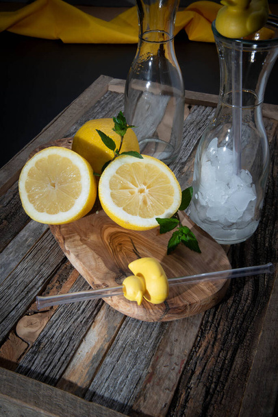 Lemon halved. Making refreshing lemonade beverage. - Photo, Image